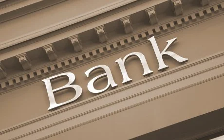Photo: generic image of the word Bank on an old building facade.