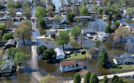An aerial view shows floodwater surrounding homes on April 07, 2025 in East Prairie, Missouri. Thunderstorms, heavy rains, high winds and tornadoes have plagued the region for the past several days, causing widespread damage before moving east. (Photo by Scott Olson/Getty Images)