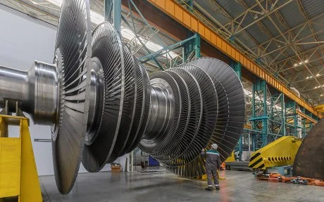 Decorative Photo: Assembly of a steam turbine rotor in a plant workshop.