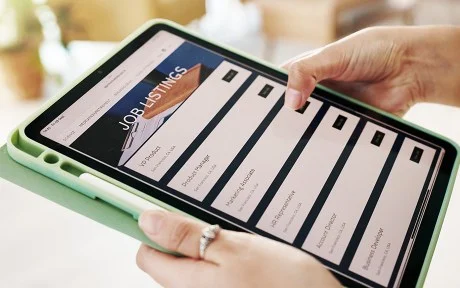Photo: Hands, person and tablet screen for job search on website, vacancy listings and contact us of recruitment process. Digital, resume app and online for hiring service, application post and opportunity.