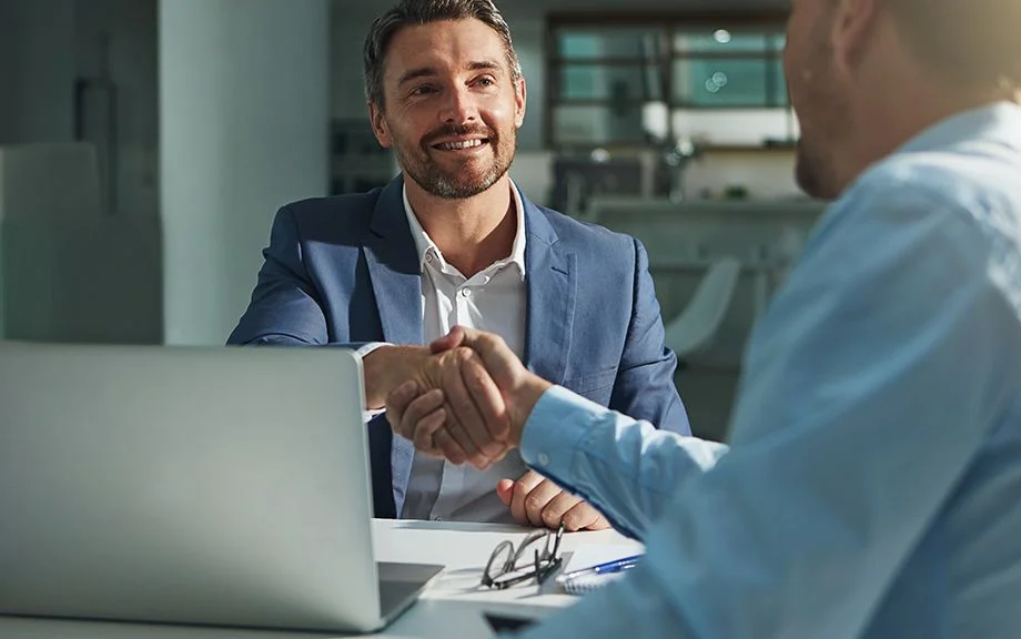 Business people, handshake and interview success or recruitment, employment and hiring in office. Corporate, men and executive shaking hands with new employee or collaboration on deal or partnership.