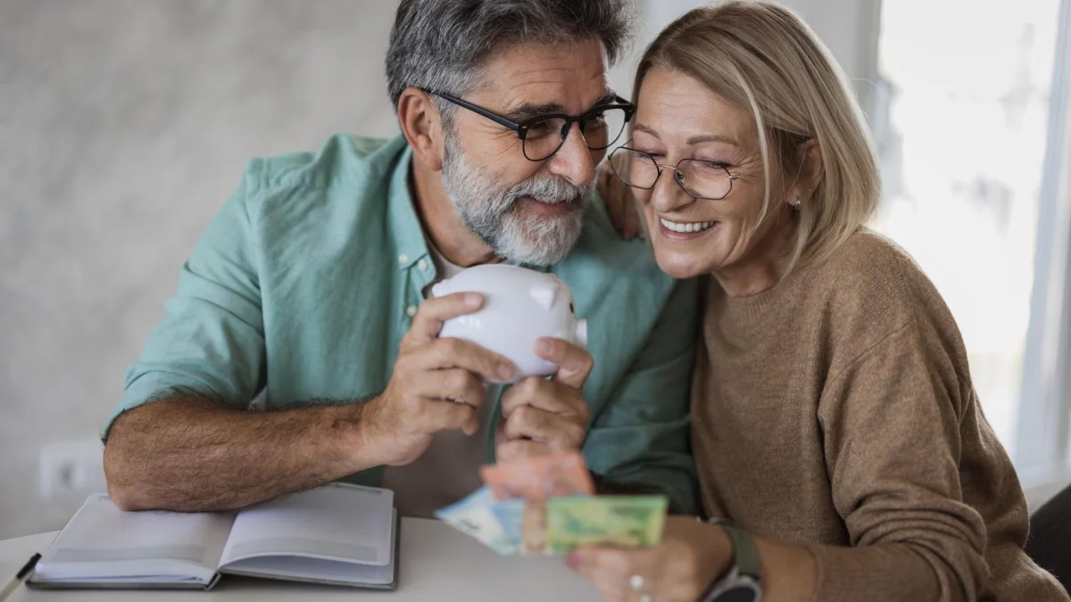 a picture of a happy couple saving money